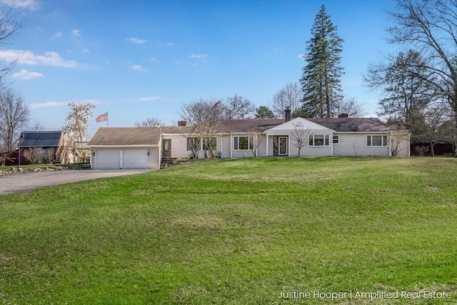 1220 W Green St, Hastings, MI 49058 - single story home featuring a front lawn, a garage, and driveway