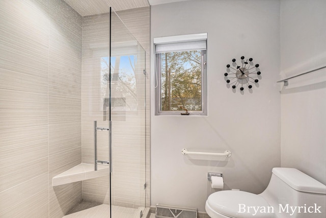 full bathroom with toilet, visible vents, and a stall shower
