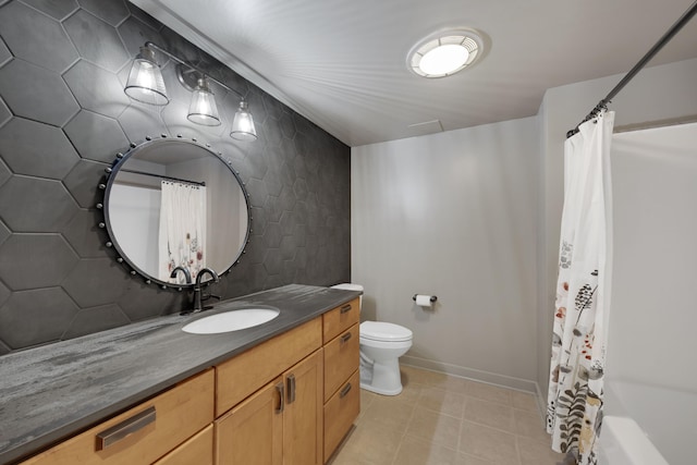 bathroom with vanity, tile patterned flooring, toilet, a shower with shower curtain, and baseboards