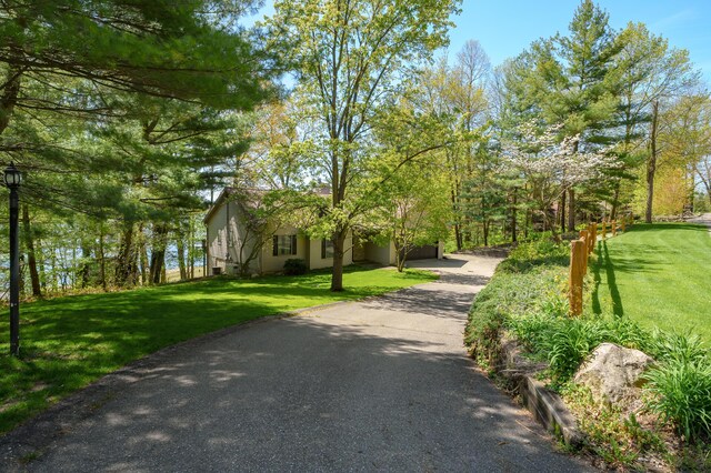 10511 Stoney Point Dr, Delton, MI 49046 - surrounding community with driveway and a lawn