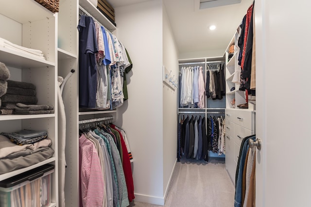 spacious closet featuring carpet flooring