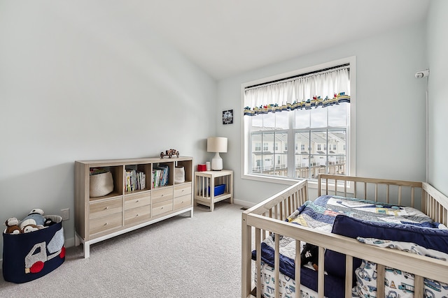 carpeted bedroom with baseboards