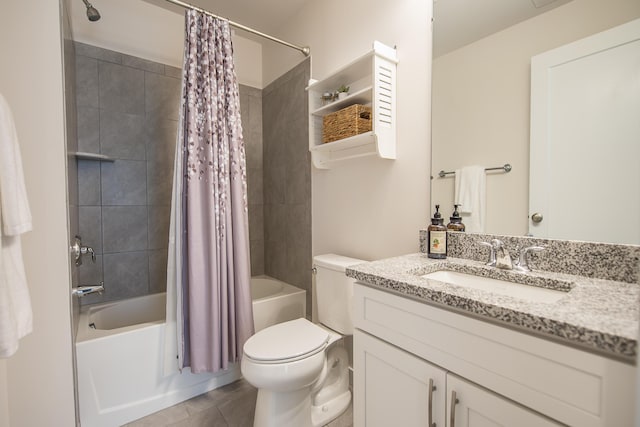 bathroom featuring shower / bath combo with shower curtain, toilet, vanity, and tile patterned floors