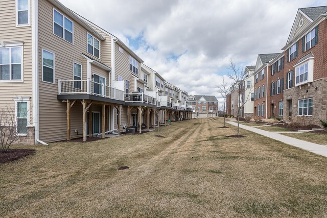view of community featuring a lawn and a residential view