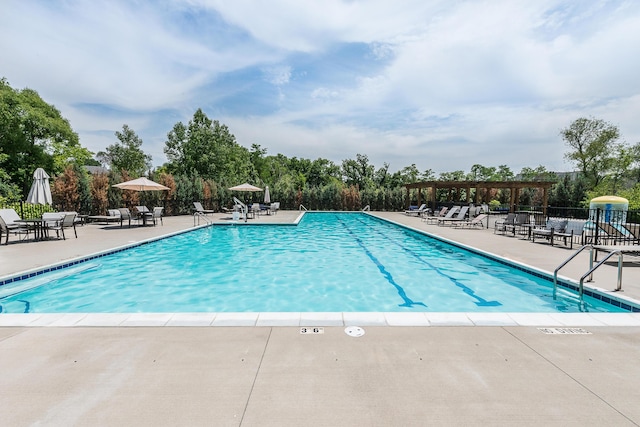 2825 Ridington Rd, Ann Arbor, MI 48105 - community pool with a pergola, a patio, and view of scattered trees