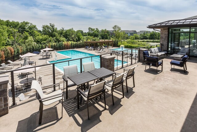 2825 Ridington Rd, Ann Arbor, MI 48105 - community pool with an outdoor hangout area, a patio, and outdoor dining space