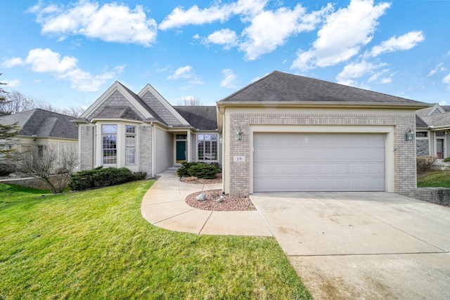 view of front facade with concrete driveway, brick siding, a garage, and a front lawn