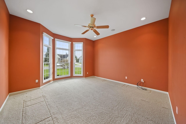 spare room featuring recessed lighting, carpet, baseboards, and a ceiling fan