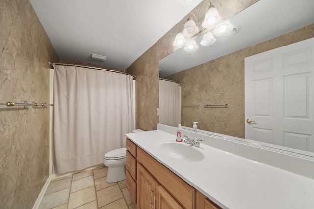 bathroom featuring toilet, curtained shower, and vanity