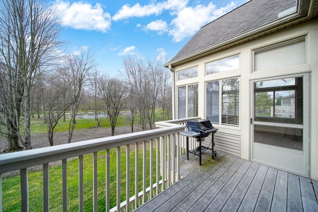 deck with a yard and grilling area