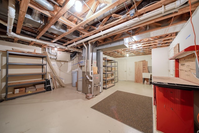 unfinished basement featuring heating unit