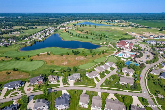 bird's eye view with a water view, a residential view, and view of golf course