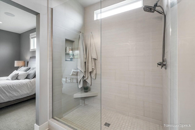 ensuite bathroom with ensuite bathroom and tiled shower