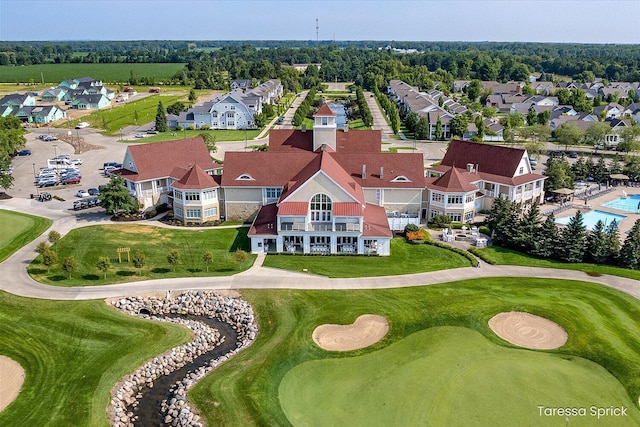 drone / aerial view with a residential view and view of golf course
