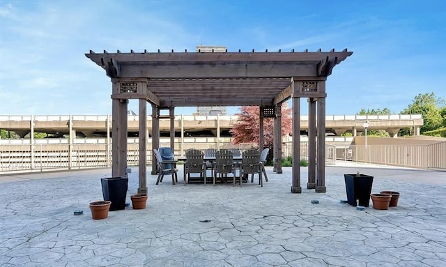 8900 E Jefferson Ave Unit 1109, Detroit, MI 48214 - view of patio with a pergola, outdoor dining area, and fence
