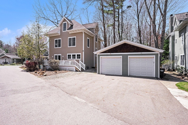 view of home's exterior featuring an outbuilding and a garage