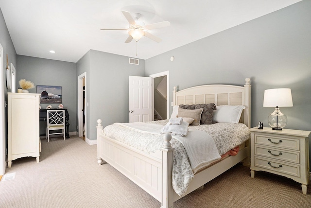 bedroom with visible vents, ceiling fan, light colored carpet, and baseboards