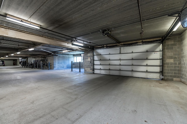garage with concrete block wall