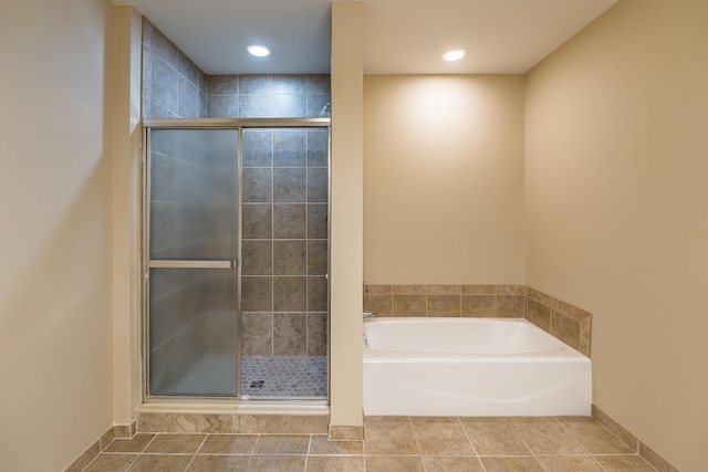 full bath with tile patterned floors, a garden tub, recessed lighting, and a shower stall