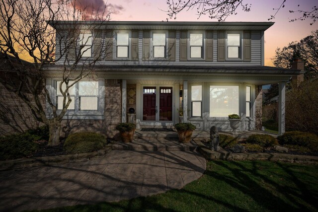 16264 White Haven Dr, Northville, MI 48168 - view of front of property with french doors and covered porch