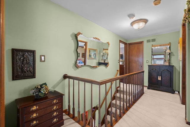 16264 White Haven Dr, Northville, MI 48168 - hall featuring visible vents, an upstairs landing, and carpet flooring