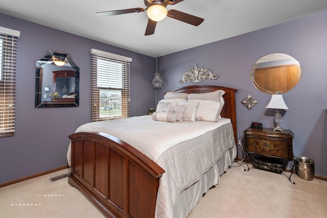 16264 White Haven Dr, Northville, MI 48168 - bedroom with light carpet, baseboards, a ceiling fan, and visible vents