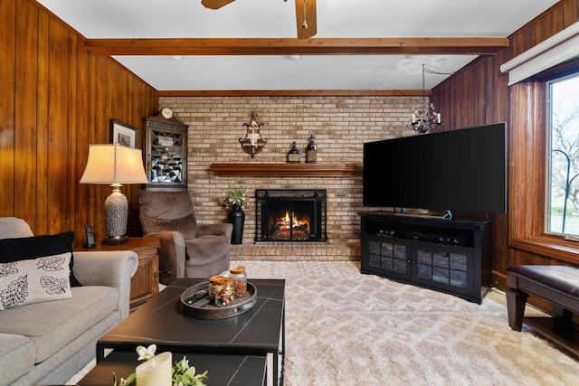 16264 White Haven Dr, Northville, MI 48168 - living room featuring beam ceiling, a brick fireplace, and wood walls
