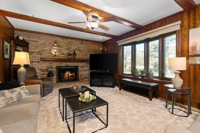 16264 White Haven Dr, Northville, MI 48168 - carpeted living room with beamed ceiling, wood walls, and a fireplace
