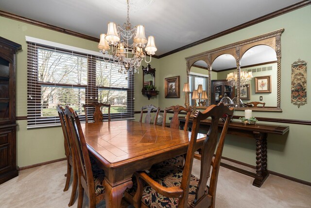 16264 White Haven Dr, Northville, MI 48168 - carpeted dining area with baseboards, an inviting chandelier, and ornamental molding