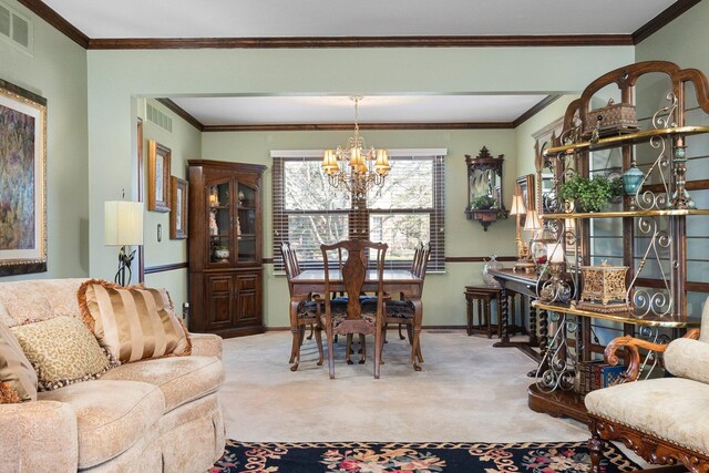 16264 White Haven Dr, Northville, MI 48168 - dining area featuring ornamental molding, visible vents, carpet, and a chandelier