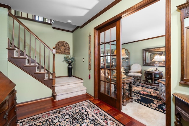16264 White Haven Dr, Northville, MI 48168 - entryway featuring wood finished floors, ornamental molding, and stairs