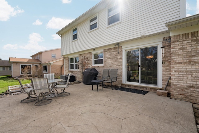 16264 White Haven Dr, Northville, MI 48168 - view of patio / terrace featuring a grill, cooling unit, and outdoor dining area