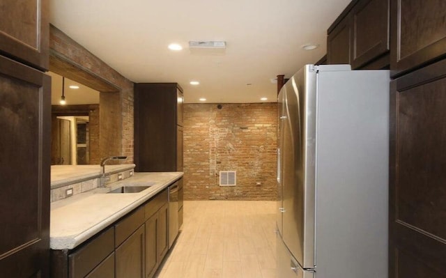 44 Lafayette Ave NE Unit 6, Grand Rapids, MI 49503 - full bath featuring a tile shower, vanity, visible vents, recessed lighting, and brick wall