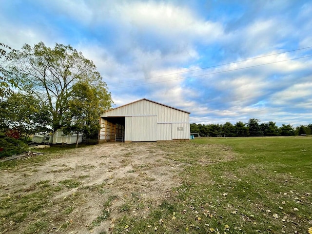 view of pole building with a lawn