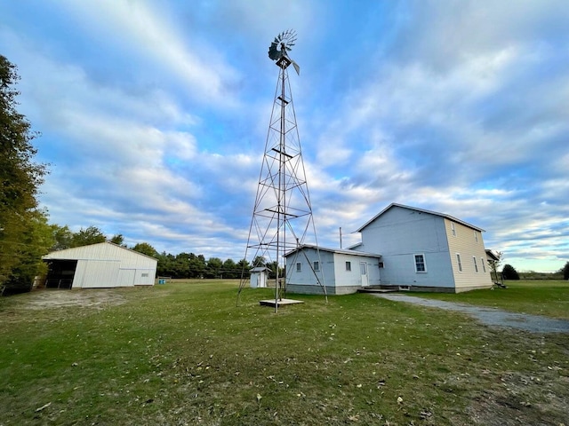 view of yard featuring an outbuilding and a pole building