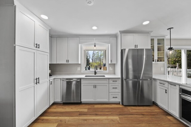 5427 Vrooman Rd, Jackson, MI 49201 - kitchen featuring appliances with stainless steel finishes, light countertops, recessed lighting, and a sink