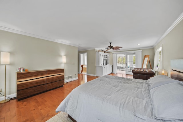 5427 Vrooman Rd, Jackson, MI 49201 - bedroom with visible vents, light wood-type flooring, ornamental molding, and baseboards