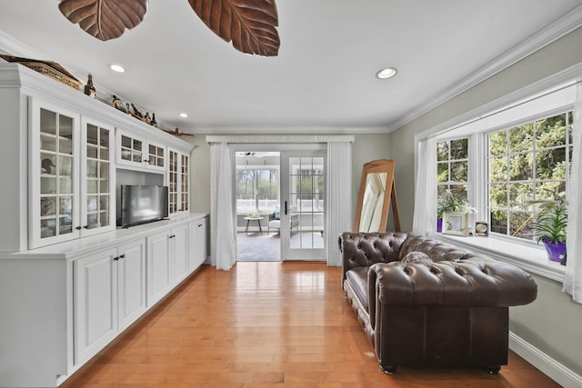 5427 Vrooman Rd, Jackson, MI 49201 - living room with crown molding, recessed lighting, baseboards, and light wood-type flooring