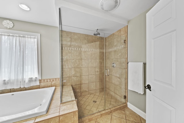 5427 Vrooman Rd, Jackson, MI 49201 - full bath featuring tile patterned floors, a shower stall, a bath, baseboards, and visible vents