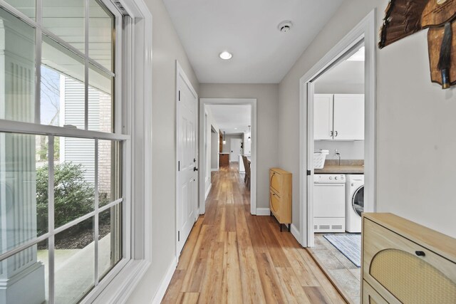 5427 Vrooman Rd, Jackson, MI 49201 - hall featuring light wood-style flooring, recessed lighting, washer / clothes dryer, and baseboards