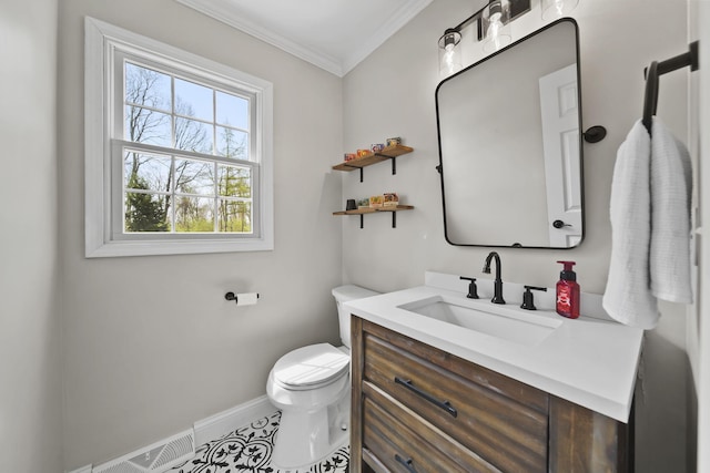 5427 Vrooman Rd, Jackson, MI 49201 - bathroom with crown molding, visible vents, baseboards, toilet, and vanity