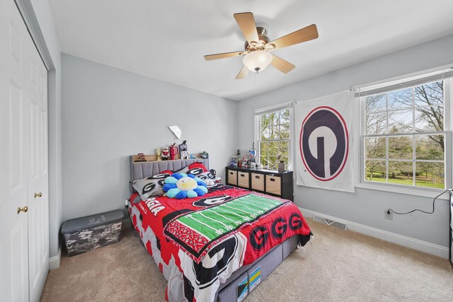 5427 Vrooman Rd, Jackson, MI 49201 - bedroom with a closet, ceiling fan, visible vents, baseboards, and carpet floors
