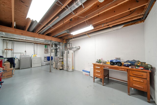 5427 Vrooman Rd, Jackson, MI 49201 - unfinished basement featuring gas water heater, concrete block wall, and washing machine and dryer
