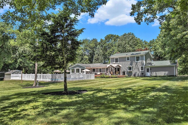 5427 Vrooman Rd, Jackson, MI 49201 - rear view of property featuring fence and a yard