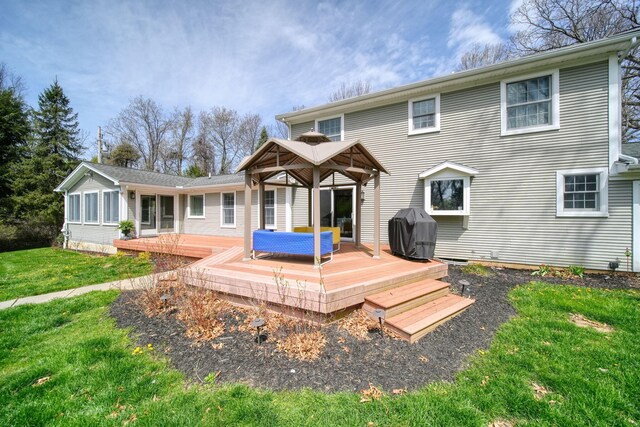 5427 Vrooman Rd, Jackson, MI 49201 - back of house featuring a gazebo, a wooden deck, and a lawn