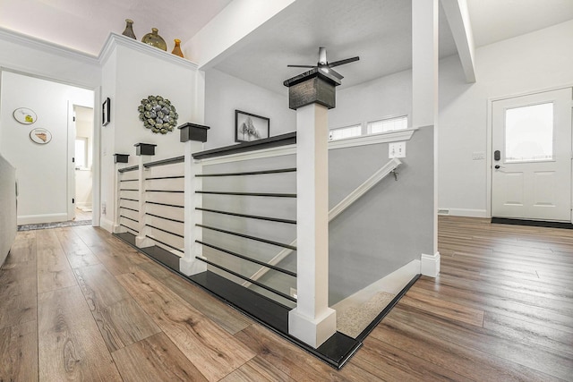 13548 Greenbriar Dr, Grand Haven, MI 49417 - interior space featuring stairway, ceiling fan, baseboards, and hardwood / wood-style floors