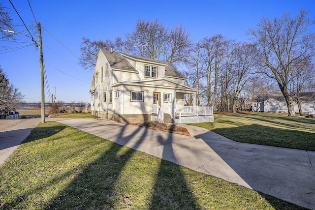 2471 Lakeshore Dr, Muskegon, MI 49441 - view of front of house with a front yard, a porch, a shingled roof, and concrete driveway