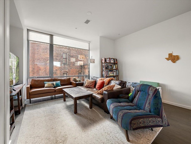 3105 Brush St, Detroit, MI 48201 - living area featuring visible vents, baseboards, and wood finished floors