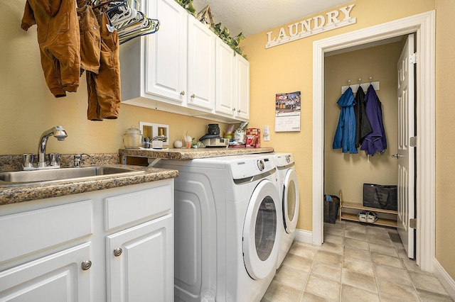 500 Mckinley, Three Rivers, MI 49093 - clothes washing area featuring baseboards, independent washer and dryer, a sink, and cabinet space