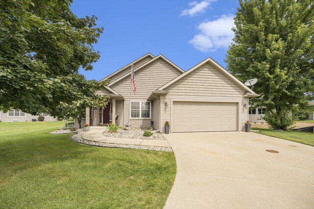 500 Mckinley, Three Rivers, MI 49093 - craftsman inspired home featuring a garage, a front yard, and concrete driveway
